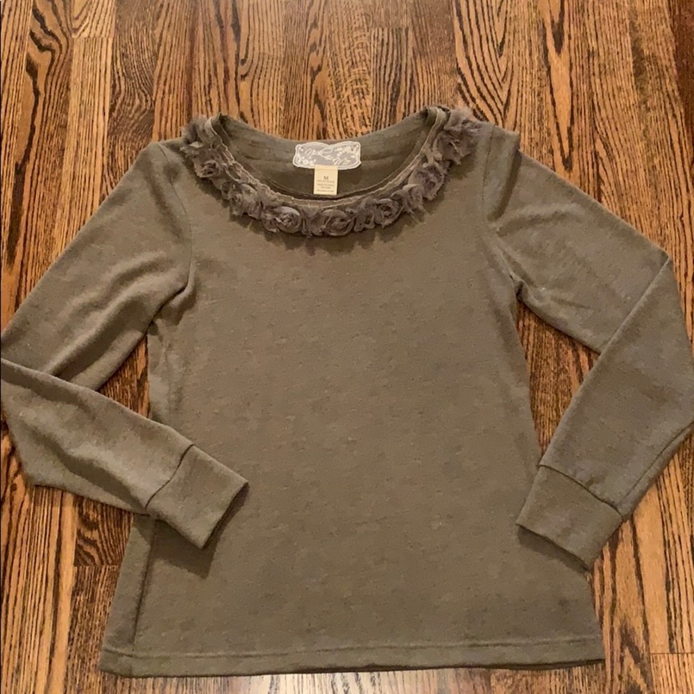 Nick and Mo green sweater floral neckline.